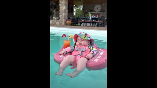 Baby relaxes in pool