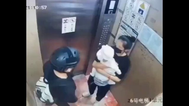 Heroic biker protects woman and her baby when their elevator falls [VIDEO]