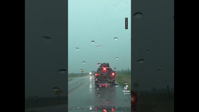 Unusual recording of a lightning strike on a car while driving