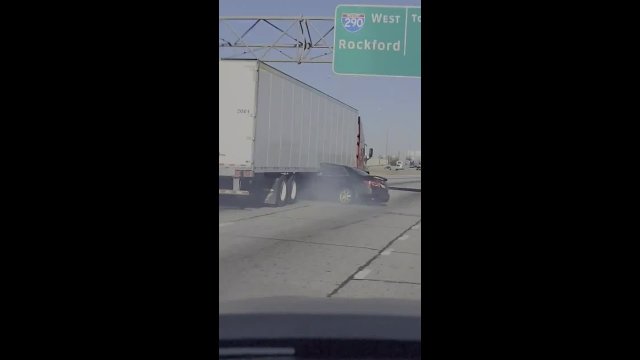 Semi-truck dragging vehicle with driver still inside