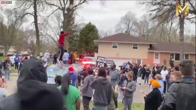 Protester falls off police car at Black Lives Matter protest