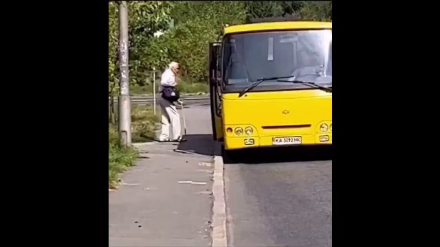 This bus driver misses to see an elder and this biker blocks the road, so the elder gets on it