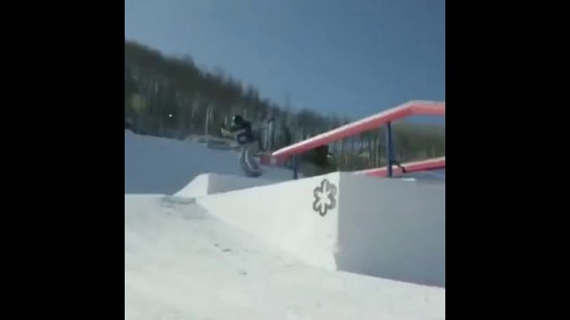 Brutal moment snowboarder slams into a metal bar and knocks herself out during practice leap