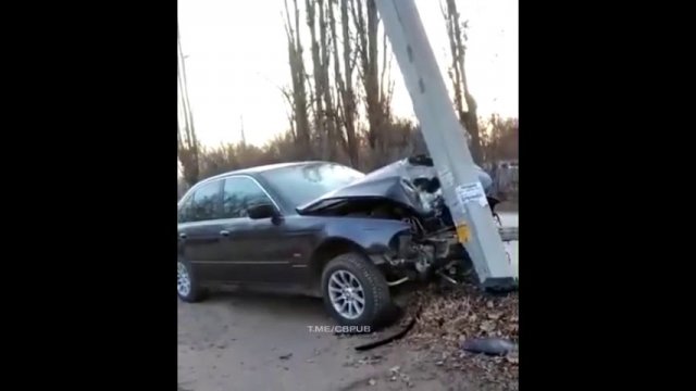 The BMW hit a concrete light pole!