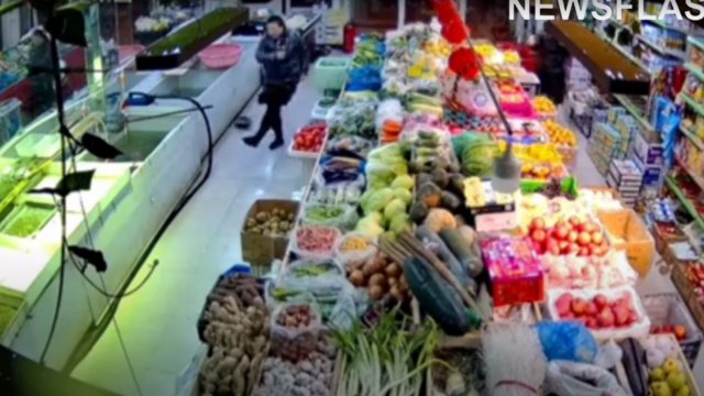 Store owner in China uses football skills to return escaped fish to tank