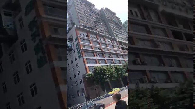This train passes through residential building in China!