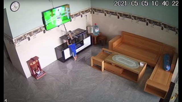 Little boy breaks television with stick