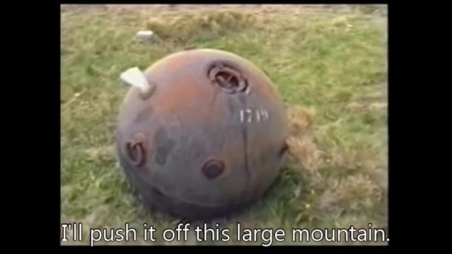 Pushing a naval mine off a mountain