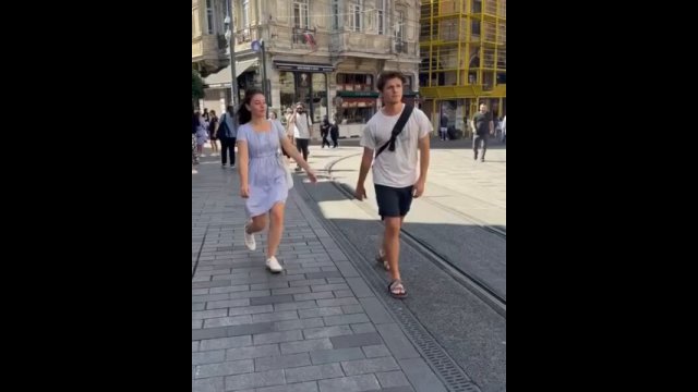 Cute girl holding hand of stranger [VIDEO]