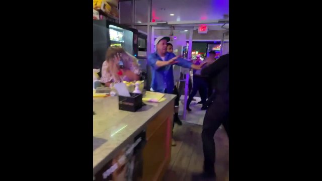 A policeman fought with aggressive people in a bar