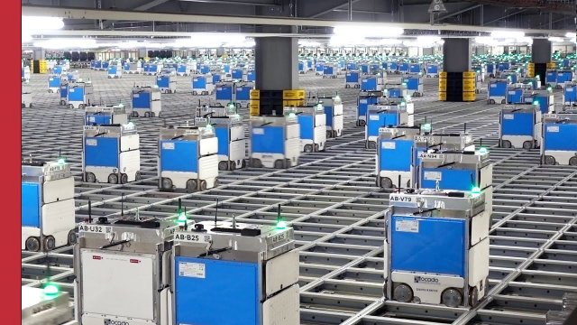 An army of more than 2,000 robots swarms in a grocery warehouse in the U.K.