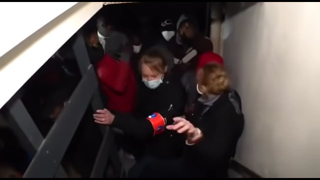 Policewomen try to stop an "illegal" party