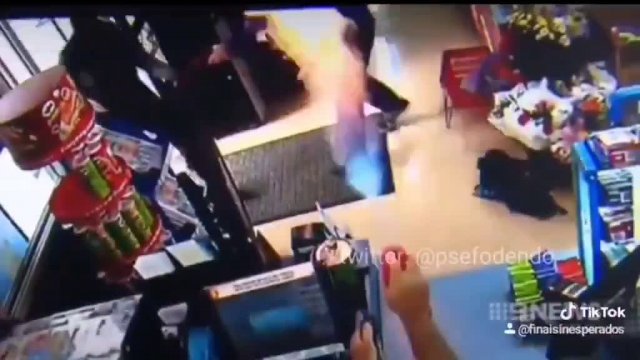Store clerk using flame thrower to fight off robbers