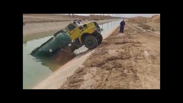Unsuccessful pulling trucks out of the water by roadside assistance specialists