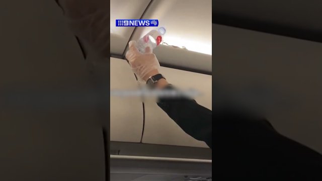 A live snake was discovered by AirAsia passengers in an overhead bin! [VIDEO]