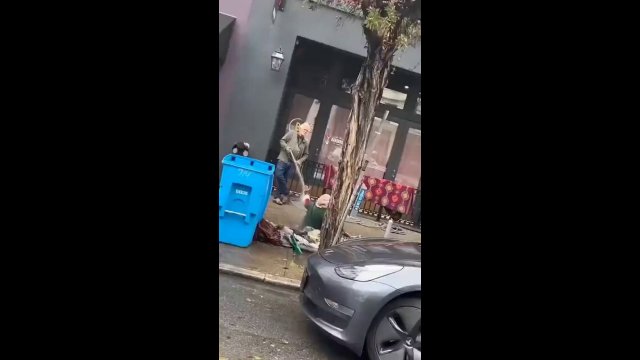 Man sprays water on a homeless woman [VIDEO]