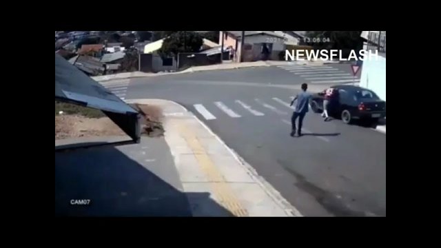 Brave Man Jumps Into Runaway Car To Stop Crash [VIDEO]