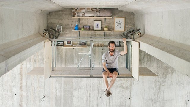 Hidden studio suspended under a bridge by Fernando Abellanas