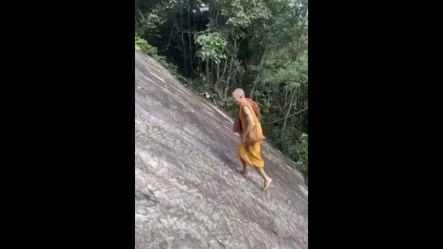 Monk Climbs Steep Hill Barefoot [VIDEO]