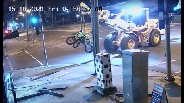 Man steals loader tractor to raid and steal motorcycles leading police on surreal chase