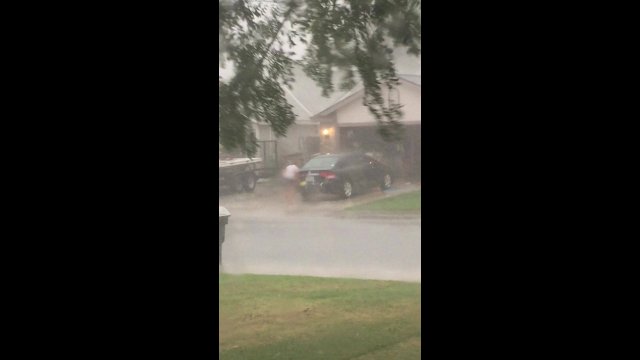 Catching your neighbor wash their car during the hurricane [VIDEO]