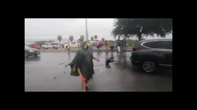 Protesters block the freeway on a rainy day causing an accident