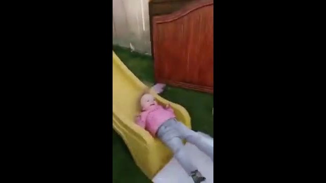 Child and the effect of slidding down on the slide