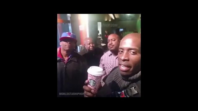 Black men holding a Starbucks cup!