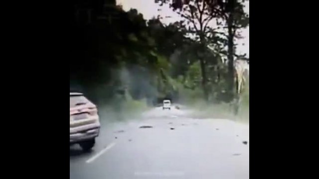 Car hit by boulder rolling down the side of a mountain
