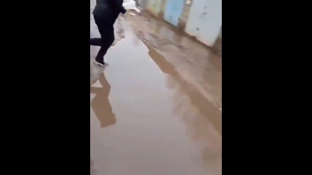 Guy Fails Comically While Attempting to Jump Over Puddle