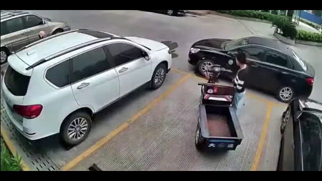 Boxed-in driver pushes car away with bare hands