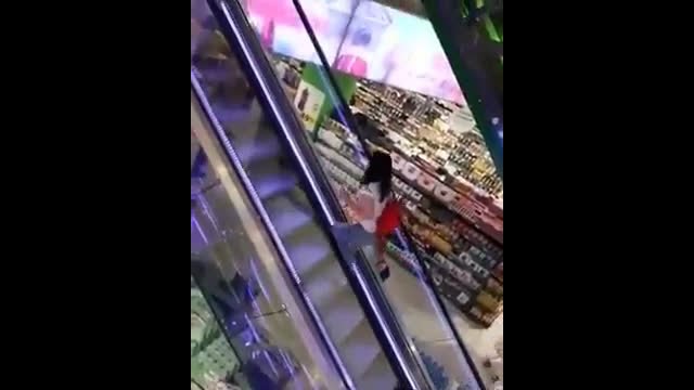 Woman vs. escalator