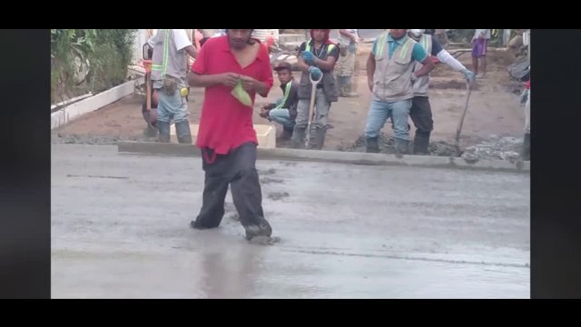 Man walks over wet cement