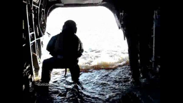 Boat Driving Into Chinook Helicopter