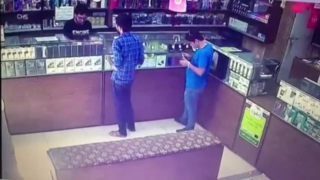 Guy smoking a cigarette starts a fire of escaping gas in a store