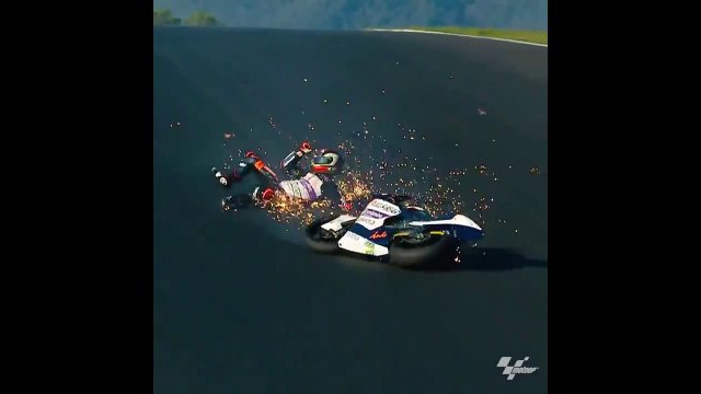MotoGP Rider Has Insane Close Call Sliding Across Track Between Other Riders