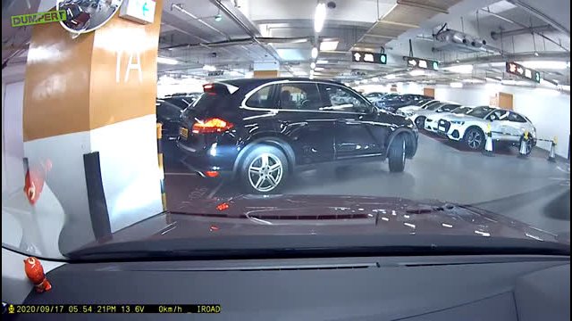 Driver Exits Car While Reversing, Door Hits Pillar & Almost Snaps Off