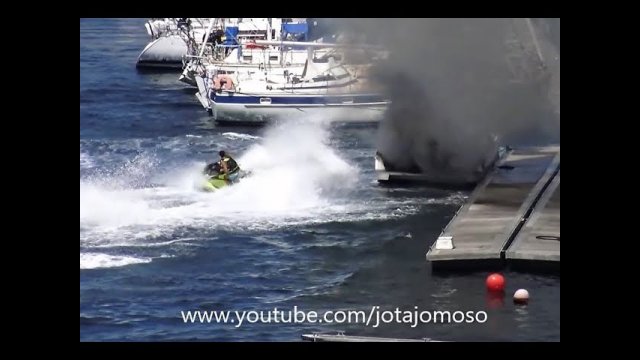 Man uses a jet-ski to extinguish a boat fire [VIDEO]