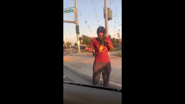 Instant karma! Belligerent man kicks car, gets caught by motorcycle cop