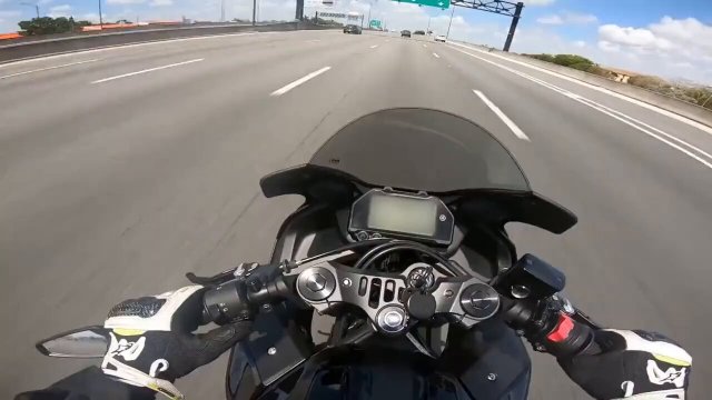 Police officer purposely slams on brakes to get biker to crash into him on the highway [VIDEO]