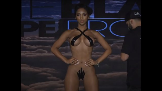 Models pose dressed only in tape