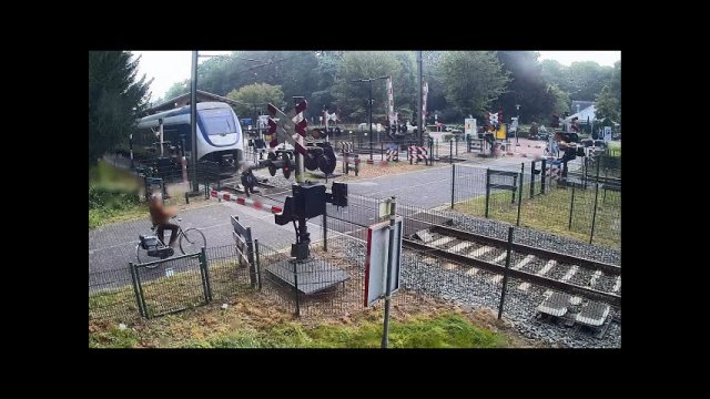 Pedestrian almost hit by train as she walks on level crossing