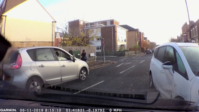 Woman doesn't give way at junction then crashes and starts swearing