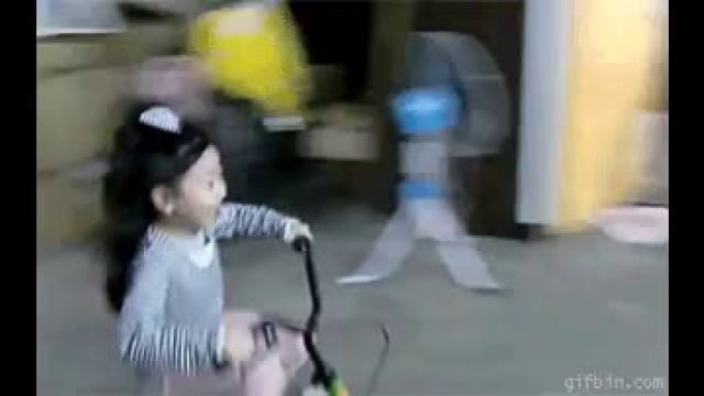 A little girl parks her bike
