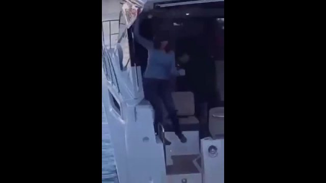 Drunk woman stumbles on deck of boat before tumbling into water