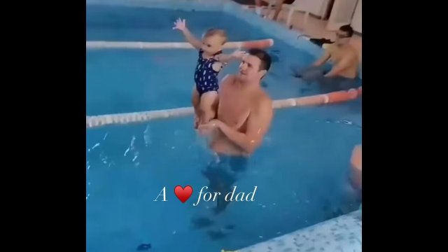 Baby taking her first swimming lesson with dad! [VIDEO]