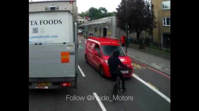 Careless biker rides out from behind stationary lorry and gets BATTERED by oncoming van