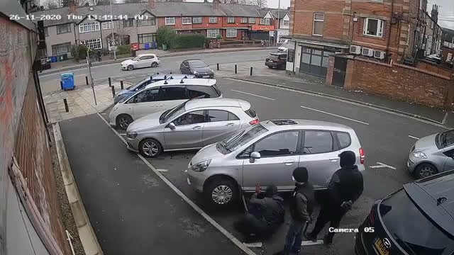 Masked thieves are caught on camera stealing catalytic converter in daylight