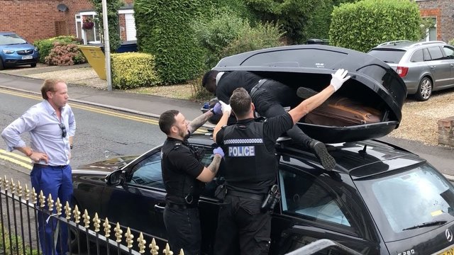 Moment migrant discovered in car box as couple return from France
