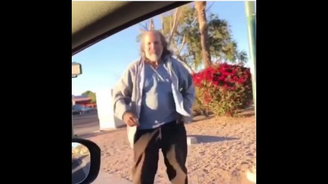Homeless guy dancing to plug walk